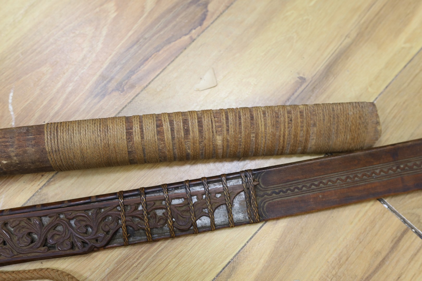 Two Burmese dha swords.